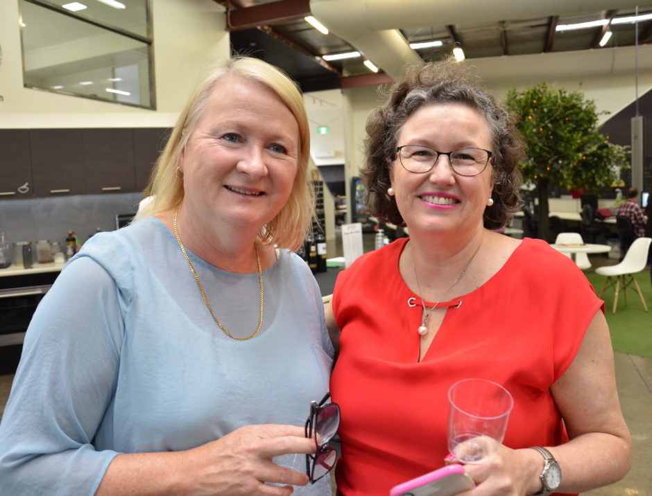 Business women at coworking space function